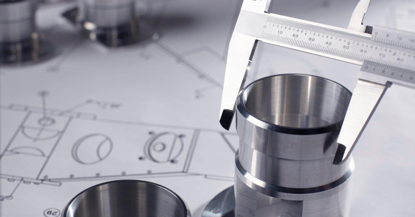 Dial calipers measuring a precision made component